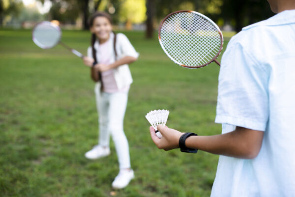 kids-playing-badminton-beautiful-summer-day